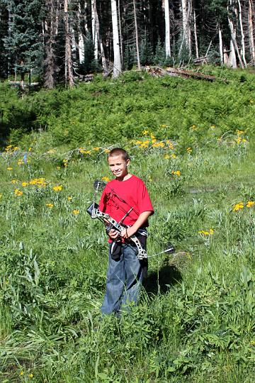 IMG_1323.jpg - Colton and his Diamond Razor Edge.  He is starting to shoot well.  4 more pounds and I'd let him shoot 30 yds without a question, 40 is getting close.